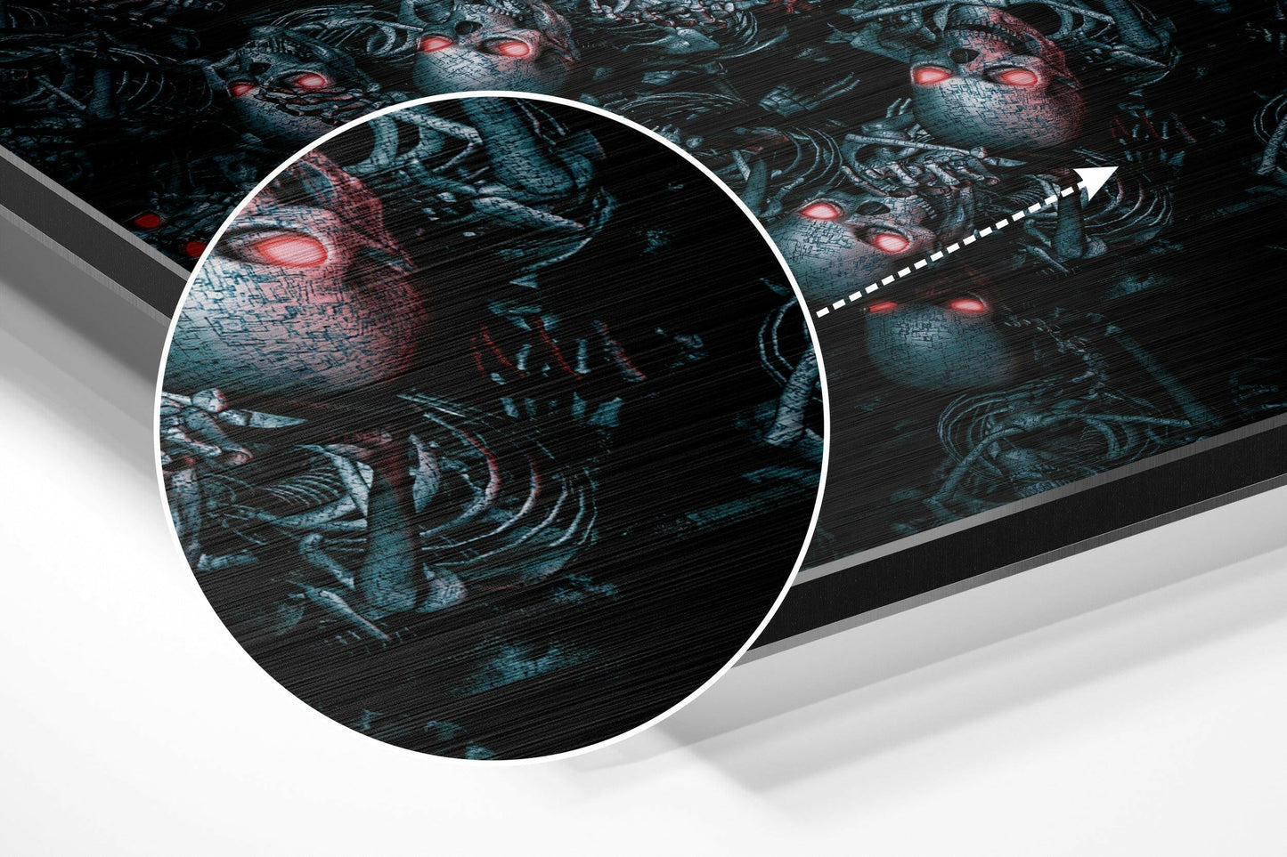 Close-up detail view of brushed aluminum surface showing dark teal textured finish with glowing red circular elements and circuit-like patterns.