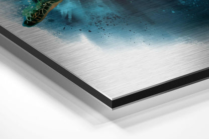 Close-up angled view of Dibond wall art showing layered edge detail with brushed aluminum surface and ocean turtle imagery in turquoise tones.