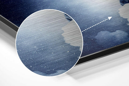Close-up angled view of brushed aluminum dibond wall art showing water surface texture with directional arrow indicating installation direction.