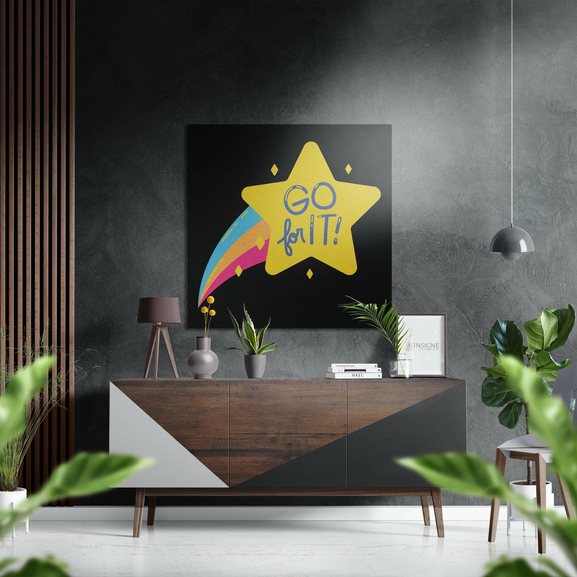 Modern living room interior featuring "Go for It" yellow star wall art with colorful rainbow trail on black background, displayed above wooden console table.