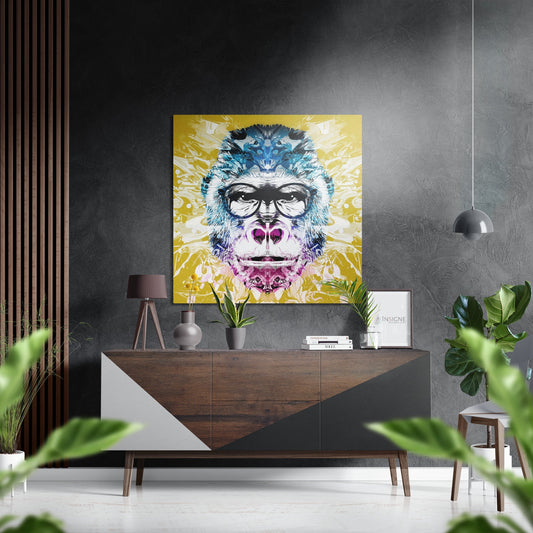 Colorful pop art monkey portrait with glasses and pink accents displayed above mid-century wooden console in modern grey interior.