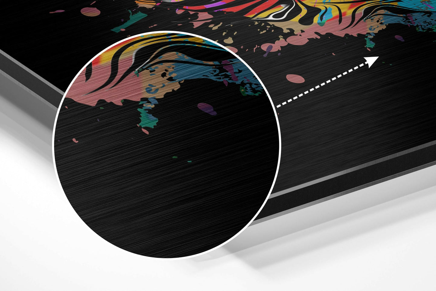 Angled perspective view of brushed aluminium wall art panel with vibrant abstract artwork featuring pink, teal, and gold swirling patterns against black background.