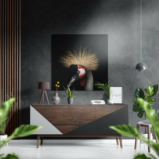 Black Dibond wall art featuring a crowned crane with golden crest displayed above mid-century modern wooden dresser in contemporary interior.