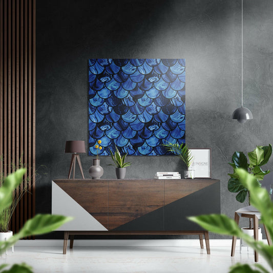 Blue iridescent scale-patterned Dibond wall art hanging above a wooden console table in a modern interior setting.
