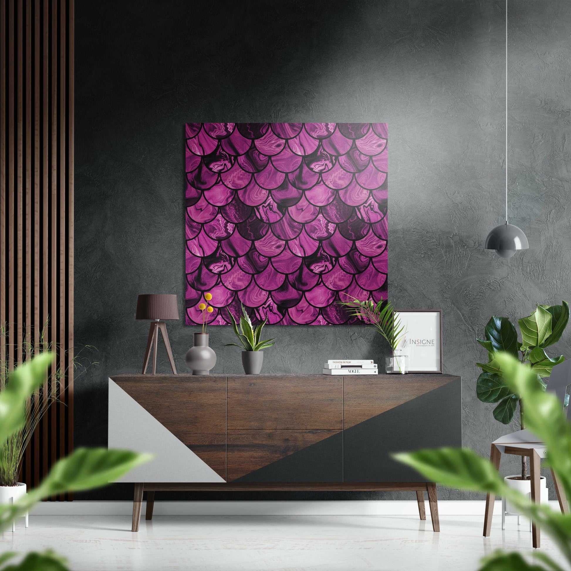 Pink Drops Brushed Aluminium Dibond Wall Art displayed above a wooden credenza in a modern interior with grey textured walls and green plants.