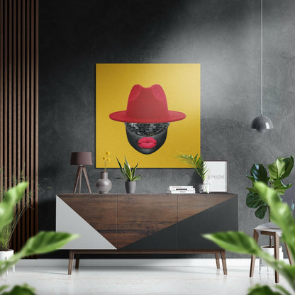 Bold yellow square wall art featuring stylized portrait with red hat, disco ball face, and red lips displayed above mid-century wooden console in modern interior.