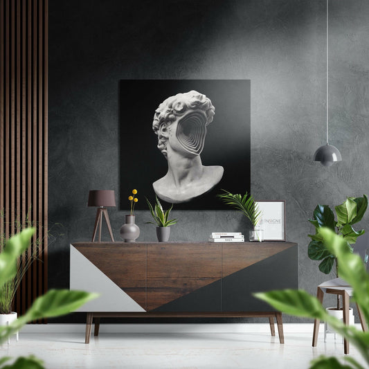 Modern interior styled with brushed aluminium spiral void statue head artwork mounted above wooden console table with plants and accessories.