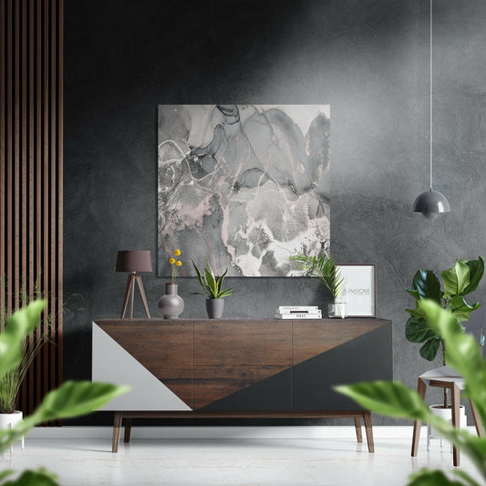 Modern interior display featuring soft gray blush marble brushed aluminum wall art mounted above wooden dresser with plants and accessories.