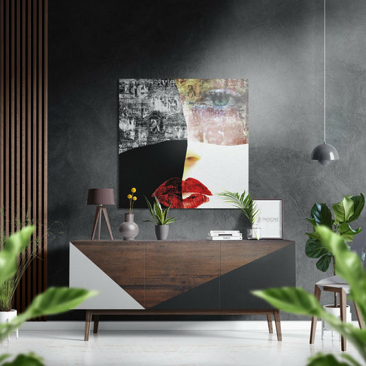 Modern living room with mixed-media wall art featuring black, white, textured, and red lip imagery displayed above a wood and white sideboard.