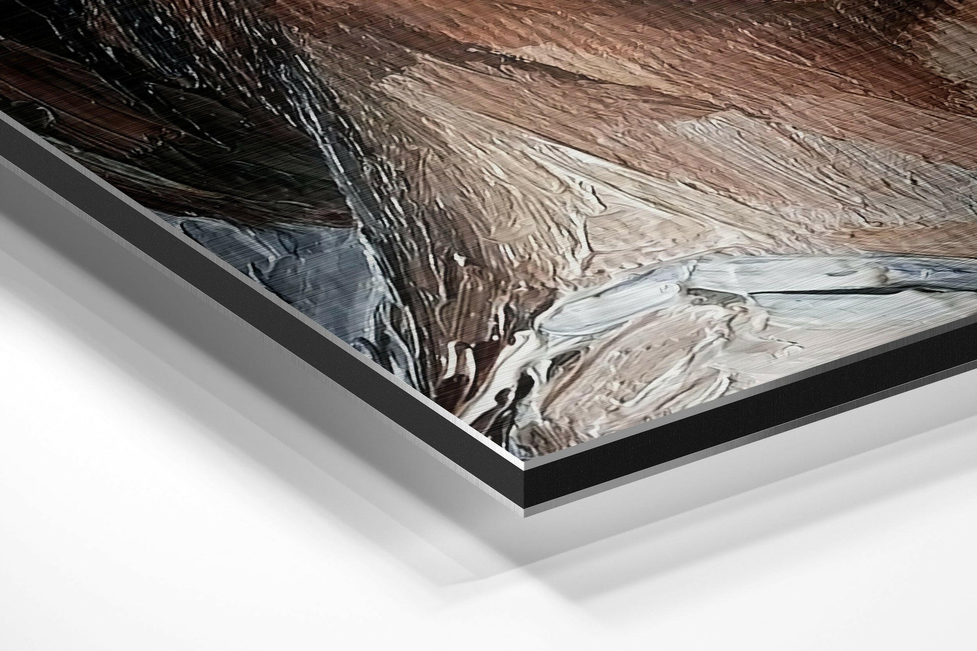 Angled product view of brushed aluminum Dibond wall art showing layered black frame edge and abstract swirled brown and white surface texture.