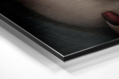 Layered diagonal view of brushed aluminum Dibond wall art showing textured black surface with white backing and silver edge trim.