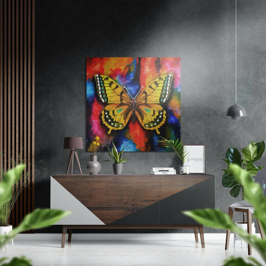 Yellow swallowtail butterfly with black and white spotted wings displayed on vibrant multicolored background above wooden dresser in modern interior.