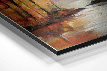 Angled perspective view of brushed aluminium Dibond wall art with warm autumn forest tones in orange, gold, and cream layered against white background.