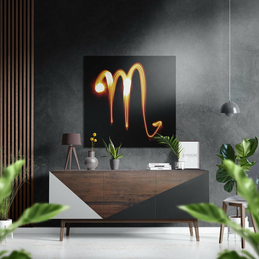 Neon glowing Scorpio symbol in amber and gold tones displayed above wooden mid-century console in modern living room setting.