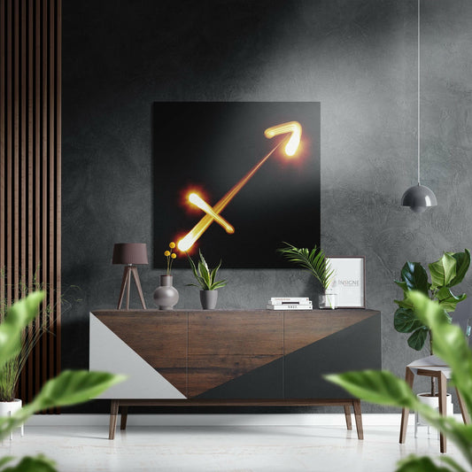 Glowing neon Sagittarius arrow symbol in gold and orange displayed on dark wall above wooden console table in modern living room setting.