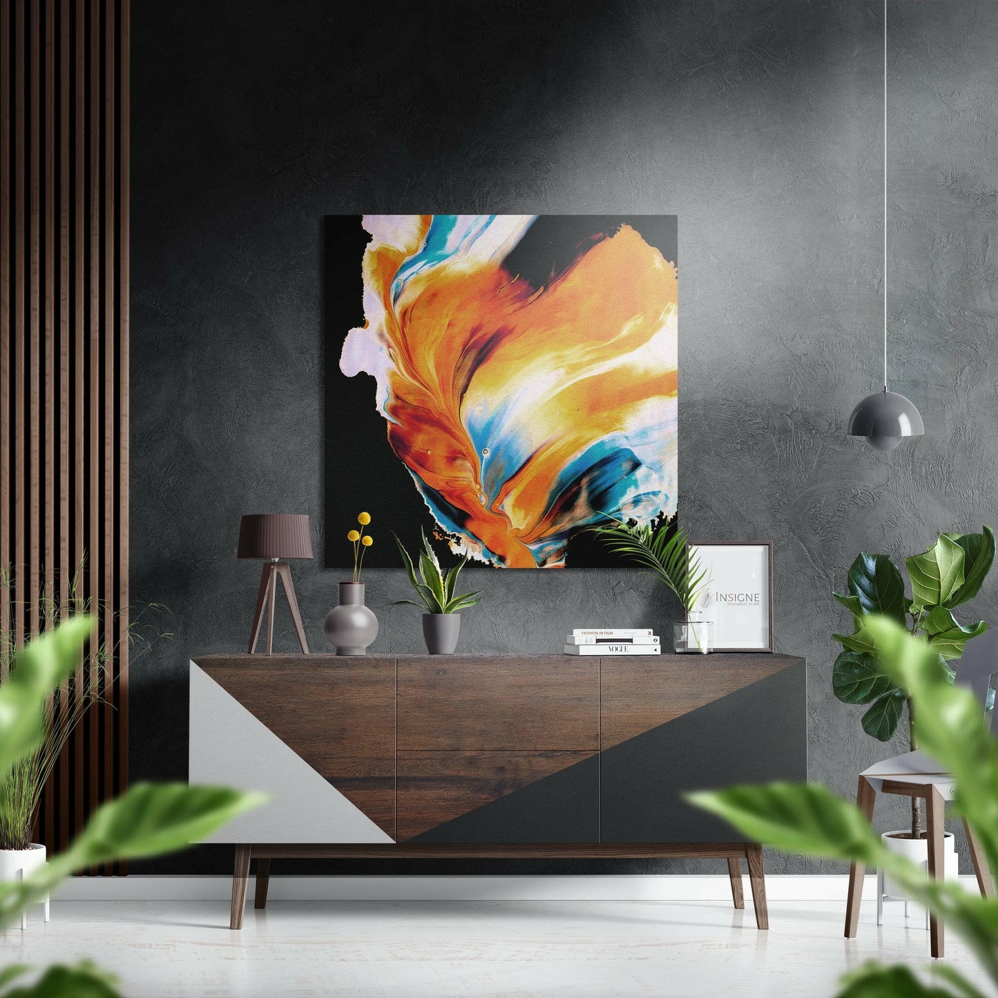 Modern living room with vibrant orange and blue abstract brushstroke wall art displayed above a wooden dresser with potted plants.