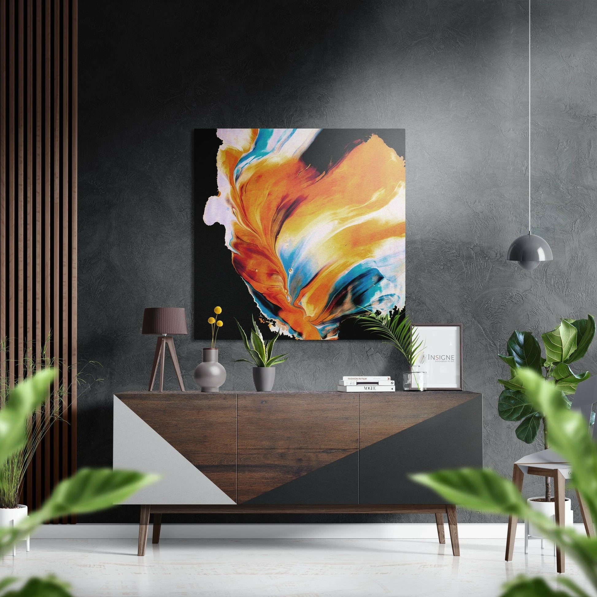 Modern living room with vibrant orange and blue abstract brushstroke wall art displayed above a wooden dresser with potted plants.