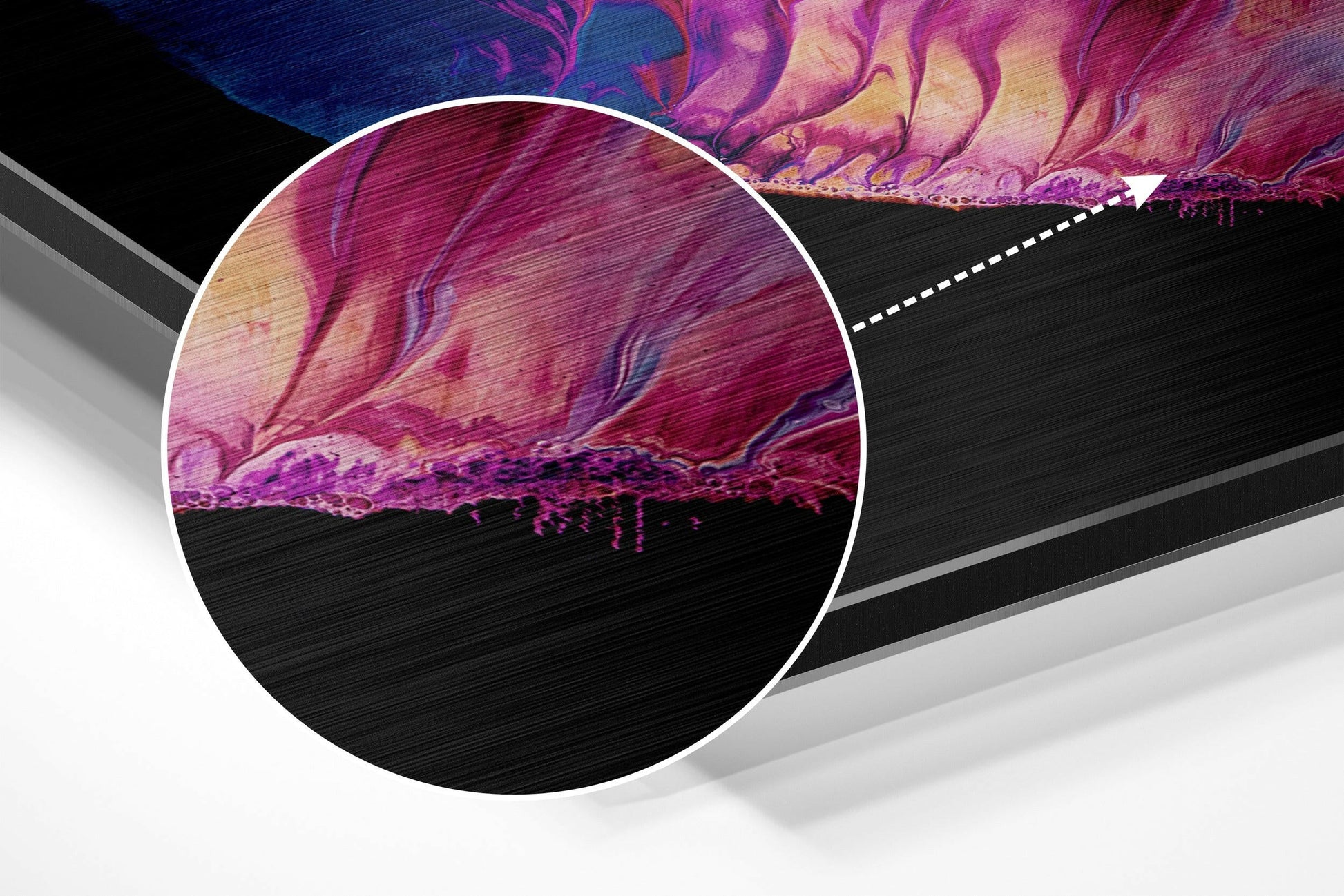 Close-up detail view of brushed aluminium surface showing vibrant magenta, purple, and pink fluid patterns with metallic texture and edge highlighting.