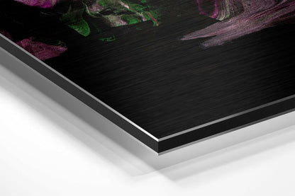 Close-up angled view of layered Dibond panel edges showing black brushed aluminum face with white backing and silver trim.