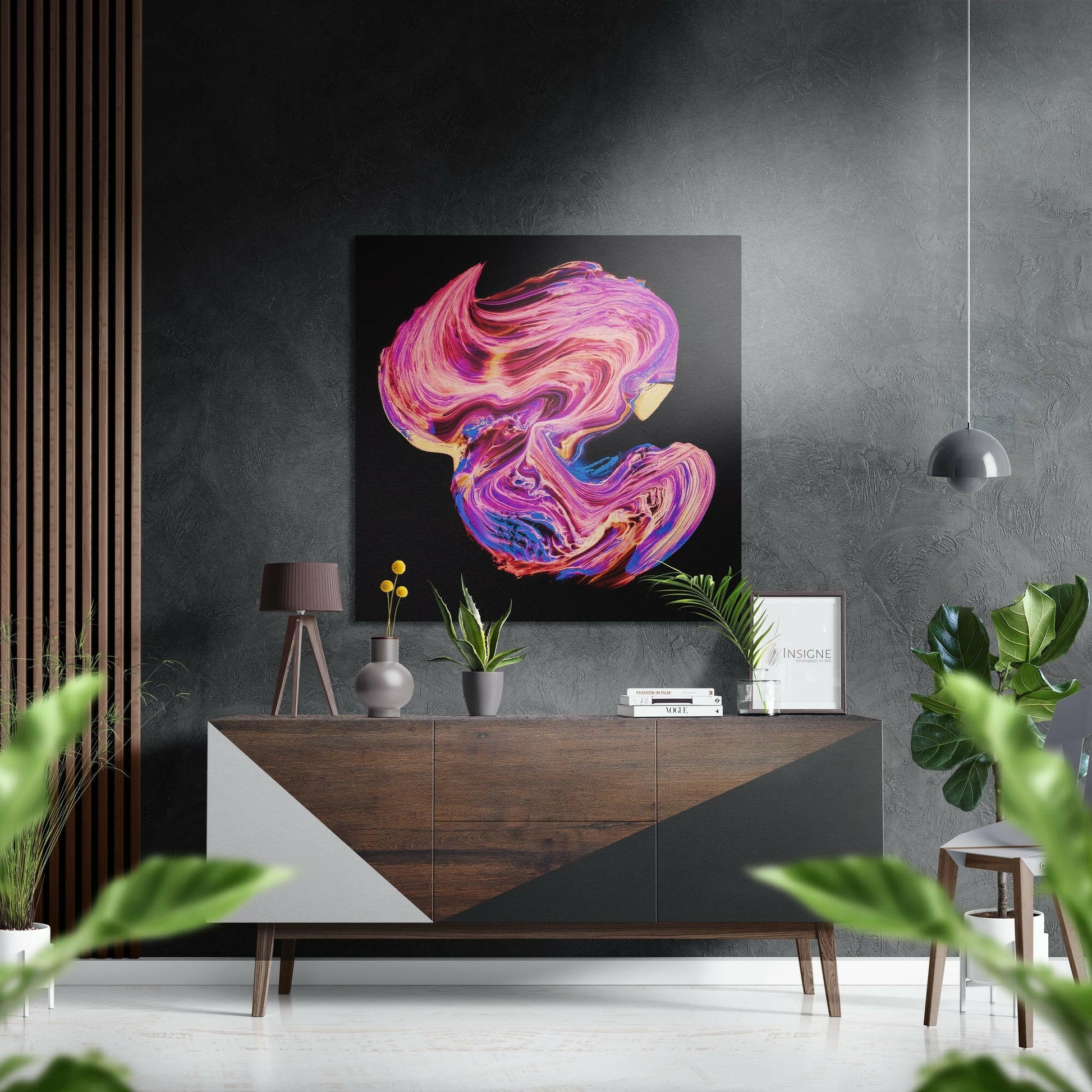 Modern interior scene with vibrant pink and purple swirled abstract artwork displayed above a wooden console table with decorative accessories and potted plants.