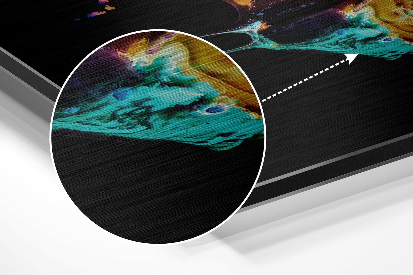 Close-up detail of brushed aluminium surface showing turquoise, yellow, and purple abstract patterns with horizontal texture.