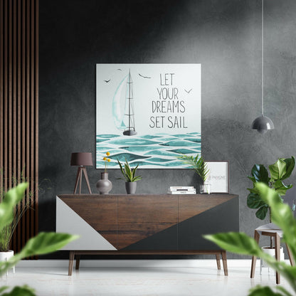 Modern interior displaying "Let Your Dreams Set Sail" sailboat wall art above wooden dresser with plants and accessories.
