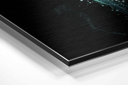 Close-up angled view of layered Dibond panel showing black brushed aluminum surface with teal sparkle details and white backing layer.