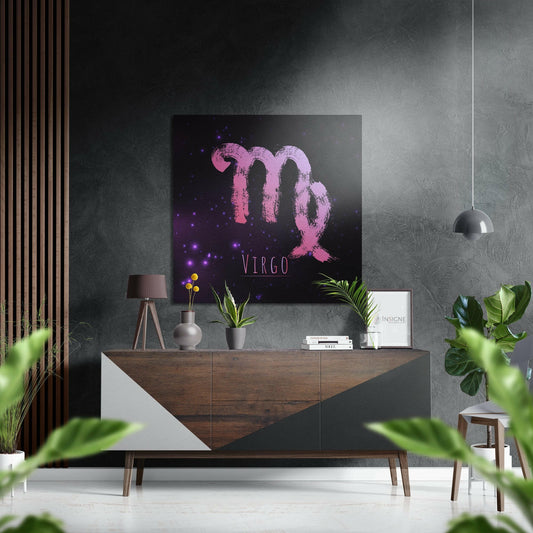 Pink Virgo symbol with purple glowing particles on black background displayed above wooden dresser in modern interior setting.