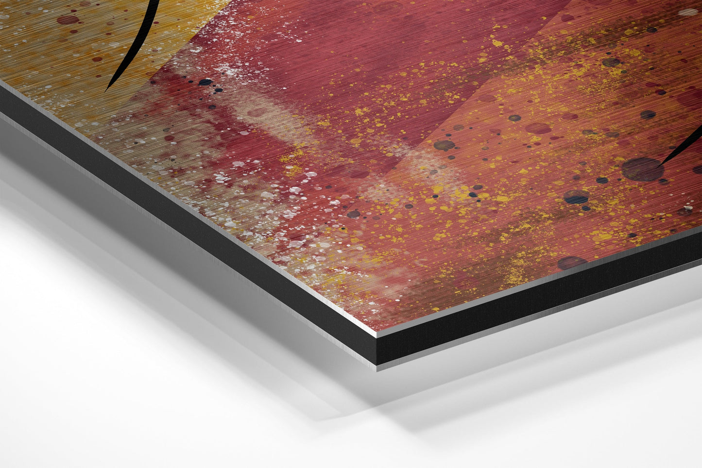 Close-up angled view of Dibond wall art showing layered edge construction with red, gold, and yellow abstract brushstroke design on aluminum surface.