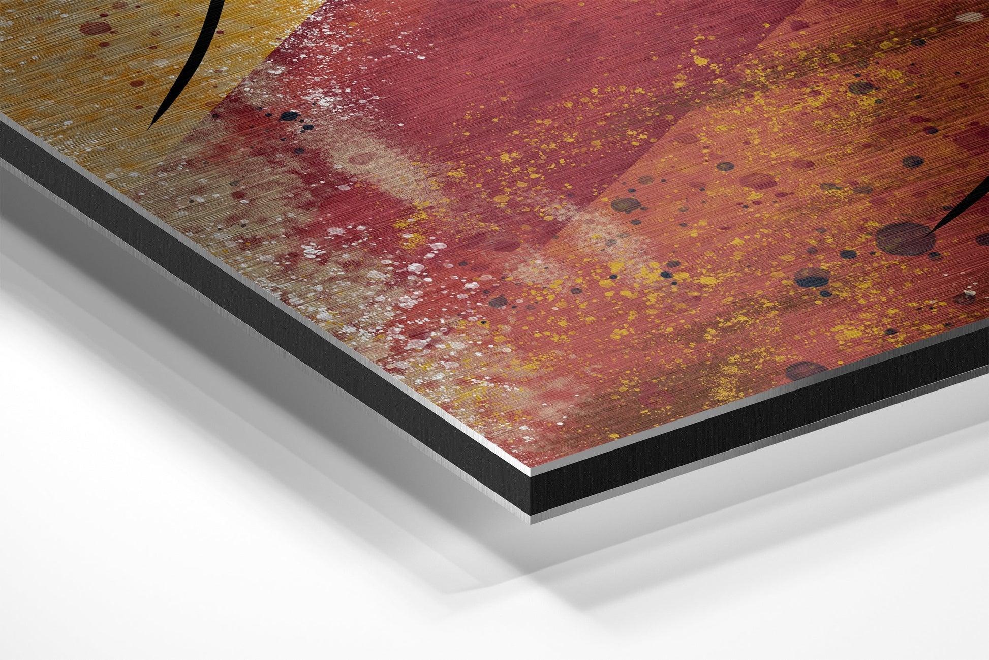 Close-up angled view of Dibond wall art showing layered edge construction with red, gold, and yellow abstract brushstroke design on aluminum surface.