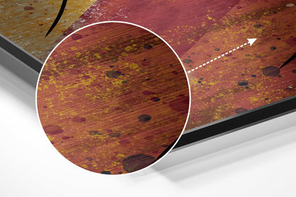 Close-up detail of brushed aluminium Dibond wall art showing rust-textured red and gold surface with circular magnified section and directional arrow.