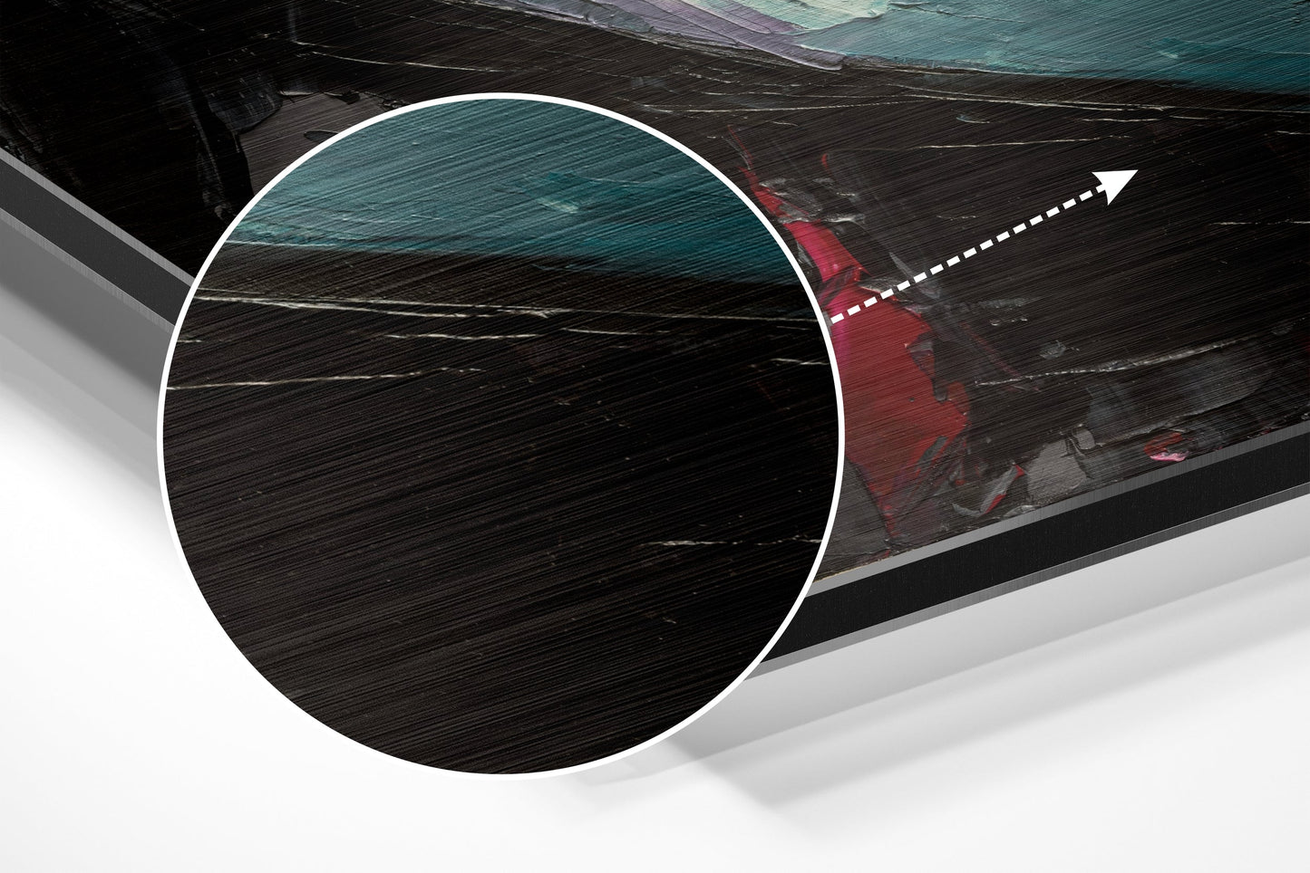 Close-up detail of brushed aluminium surface texture with circular white border and directional arrow overlay on dark wood boat background.