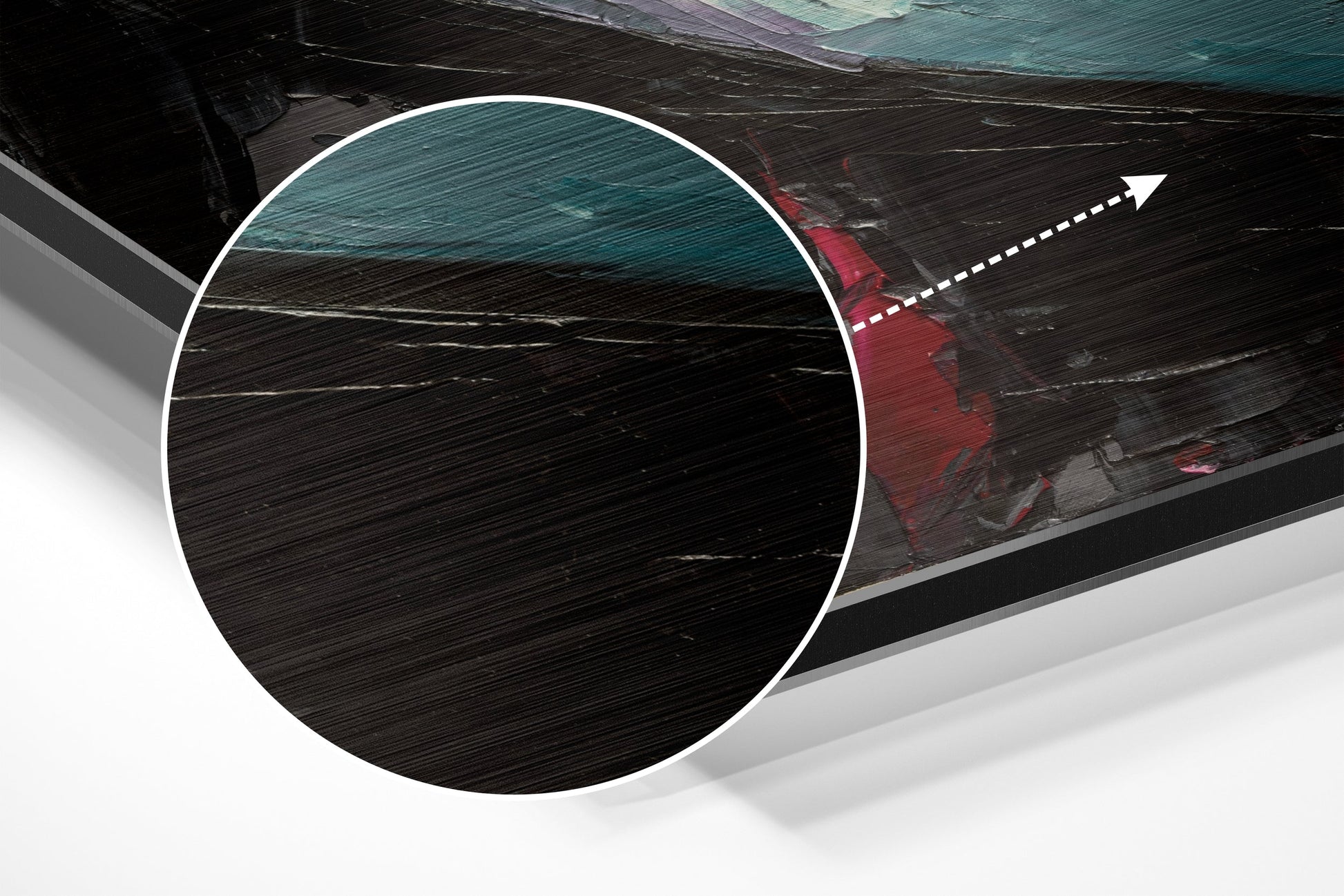 Close-up detail of brushed aluminium surface texture with circular white border and directional arrow overlay on dark wood boat background.