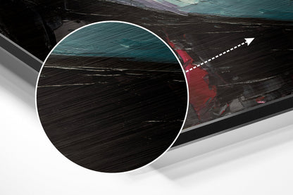 Close-up detail of brushed aluminium surface texture with circular white border and directional arrow overlay on dark wood boat background.