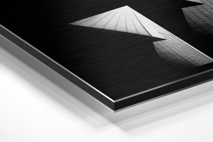 Isometric product view showing layered construction of brushed aluminum dibond wall art with black textured surface and white backing layers.