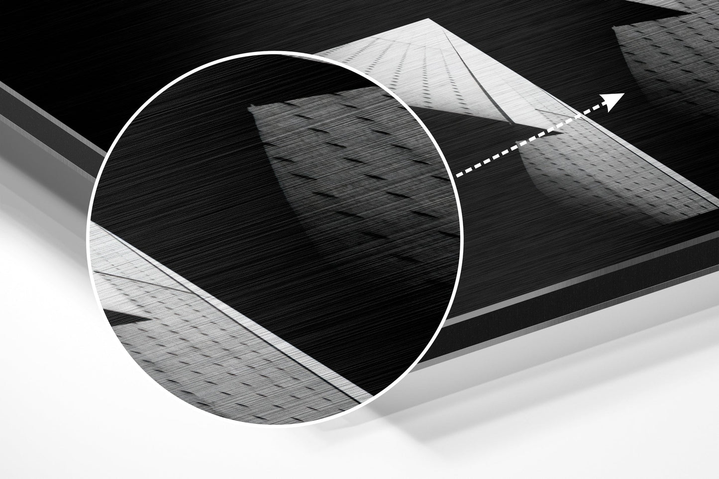 Abstract architectural composition featuring circular brushed aluminum frame with geometric building facades in black and white tones.