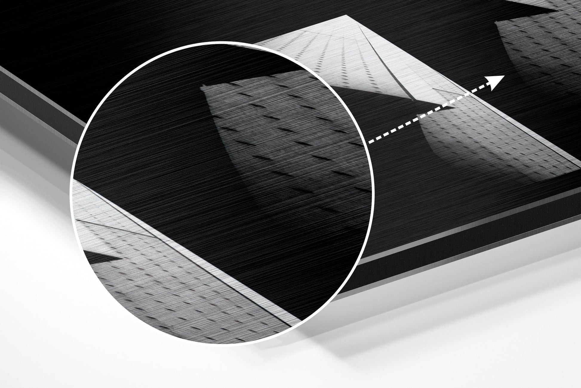 Abstract architectural composition featuring circular brushed aluminum frame with geometric building facades in black and white tones.