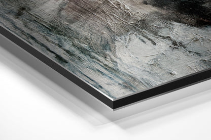 Angled perspective view of brushed aluminium Dibond wall art showing layered edges and gray textured surface with black border frame.