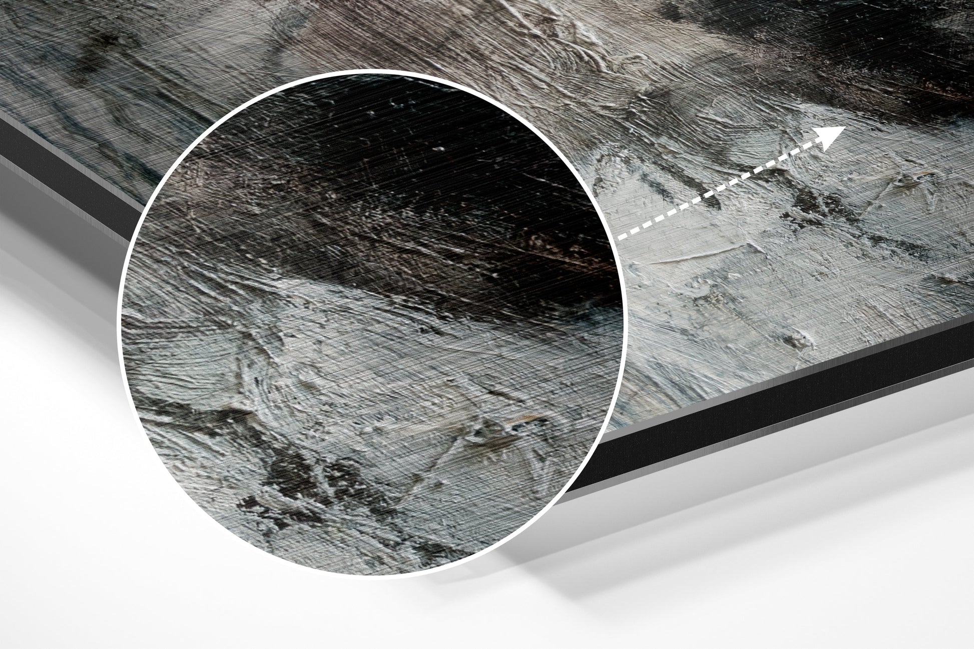 Close-up detail of brushed aluminium Dibond wall art showing textured metallic surface with directional grain patterns and subtle reflective qualities.