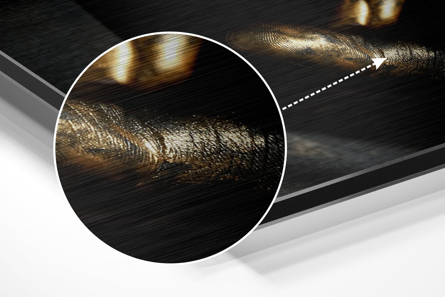 Close-up detail of brushed aluminum surface showing gold and bronze metallic brushstrokes with directional arrow indicator.