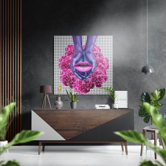 Modern interior with brushed aluminum wall art featuring purple hands, pink lips, and pink carnation flowers on geometric grid background displayed above wooden dresser.