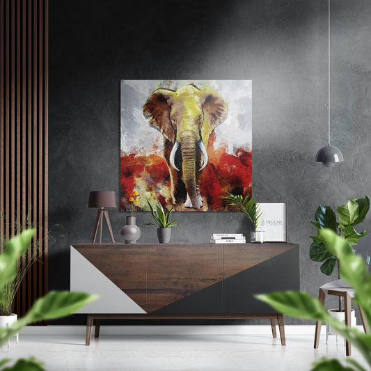 Modern interior display featuring a front-facing painted elephant artwork in yellow, red, and white tones mounted above a wooden console table.