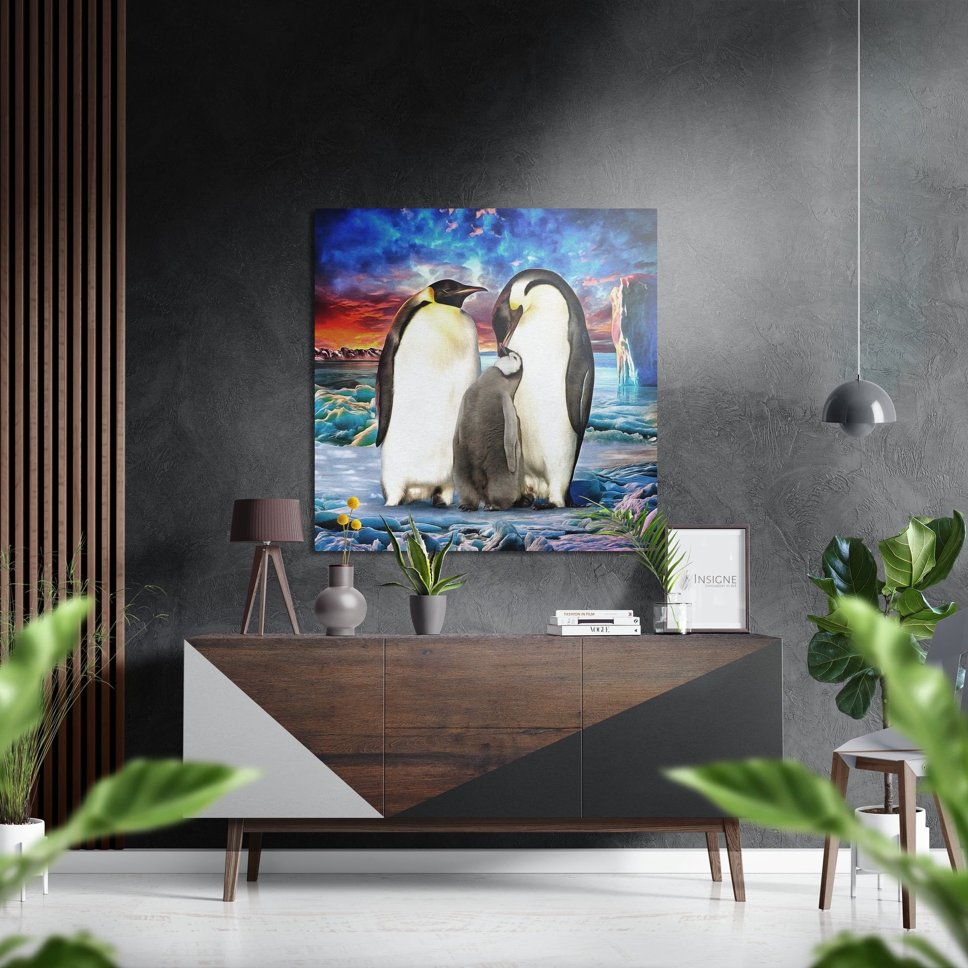 Penguin Family Brushed Aluminium Dibond Wall Art displayed above wooden dresser in modern living room with gray walls and hanging pendant light.