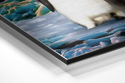 Angled detail shot of brushed aluminium Dibond wall art showing layered frame construction with coastal landscape scene featuring blue water and white penguins.