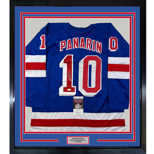 Blue New York Rangers jersey number 10 with "PANARIN" nameplate, framed with red and white striped sleeves, JSA authentication certificate visible.
