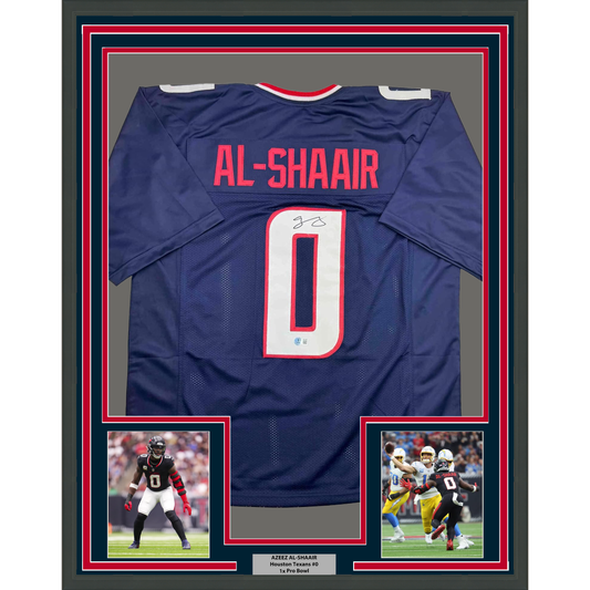 Framed navy blue Houston Texans football jersey number 0 with "AL-SHAAIR" nameplate, signed, displayed with two action photos below.