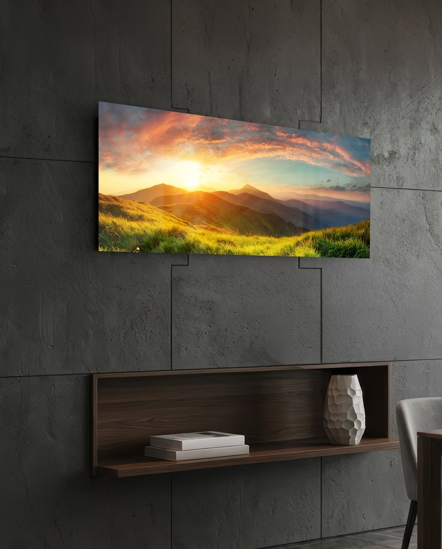 Valley Glass Wall Art mounted on concrete wall above wooden shelf, displaying golden sunset over mountains and green grassland.