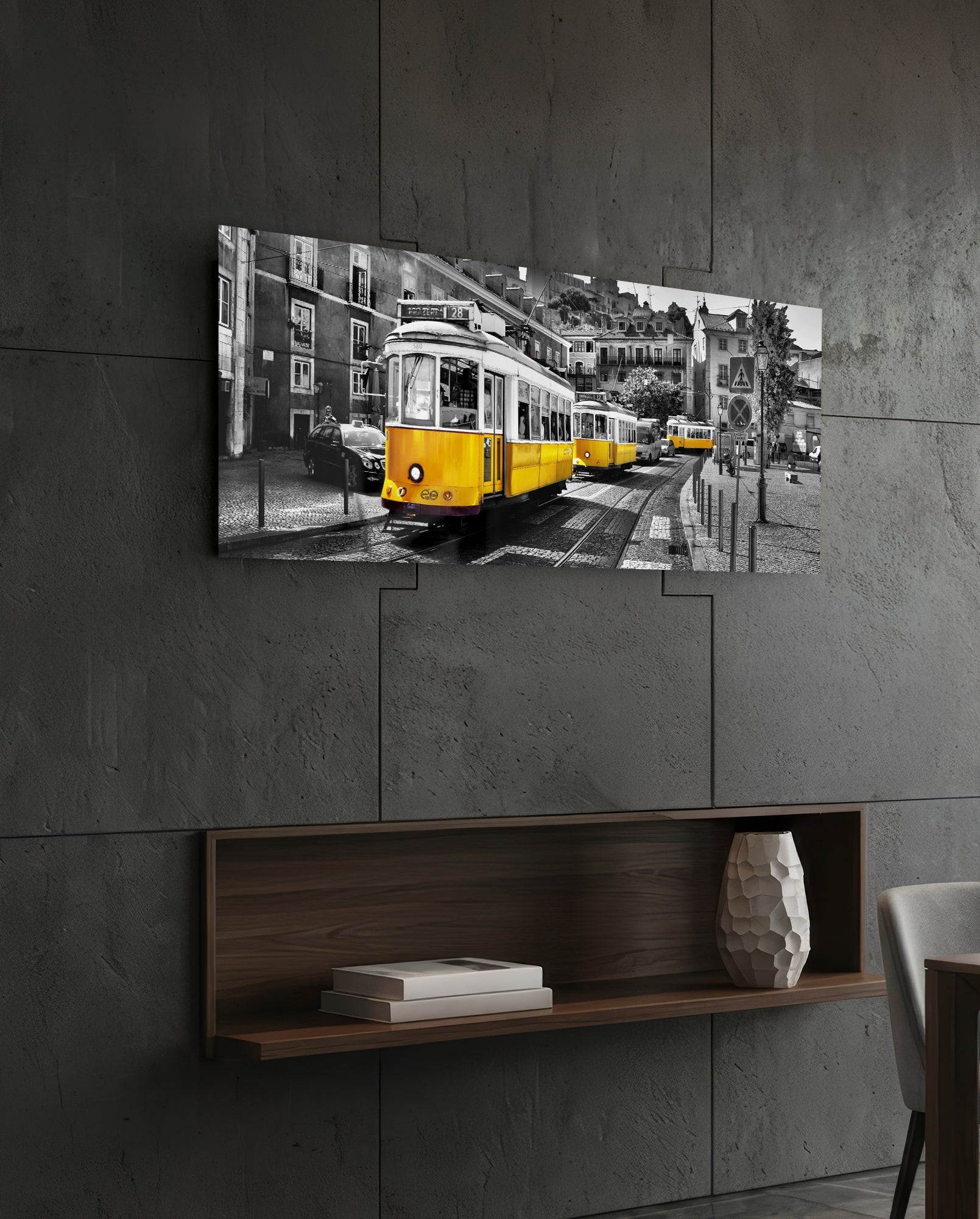 Yellow vintage tram on monochrome European street scene displayed as horizontal glass wall art above wooden shelf.