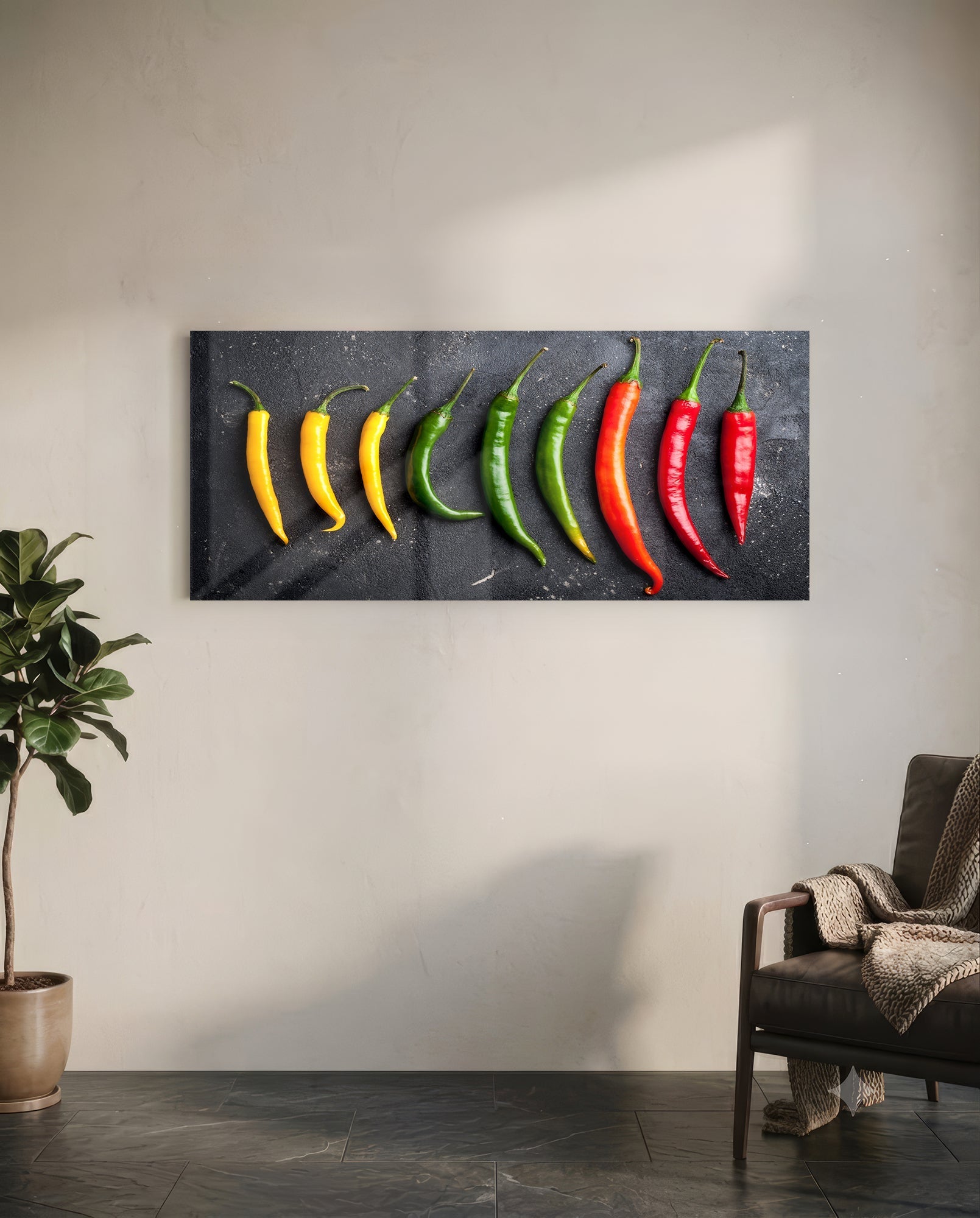 Glass wall art displaying ten peppers in gradient colors from yellow to red arranged horizontally on dark background, mounted in modern room setting.