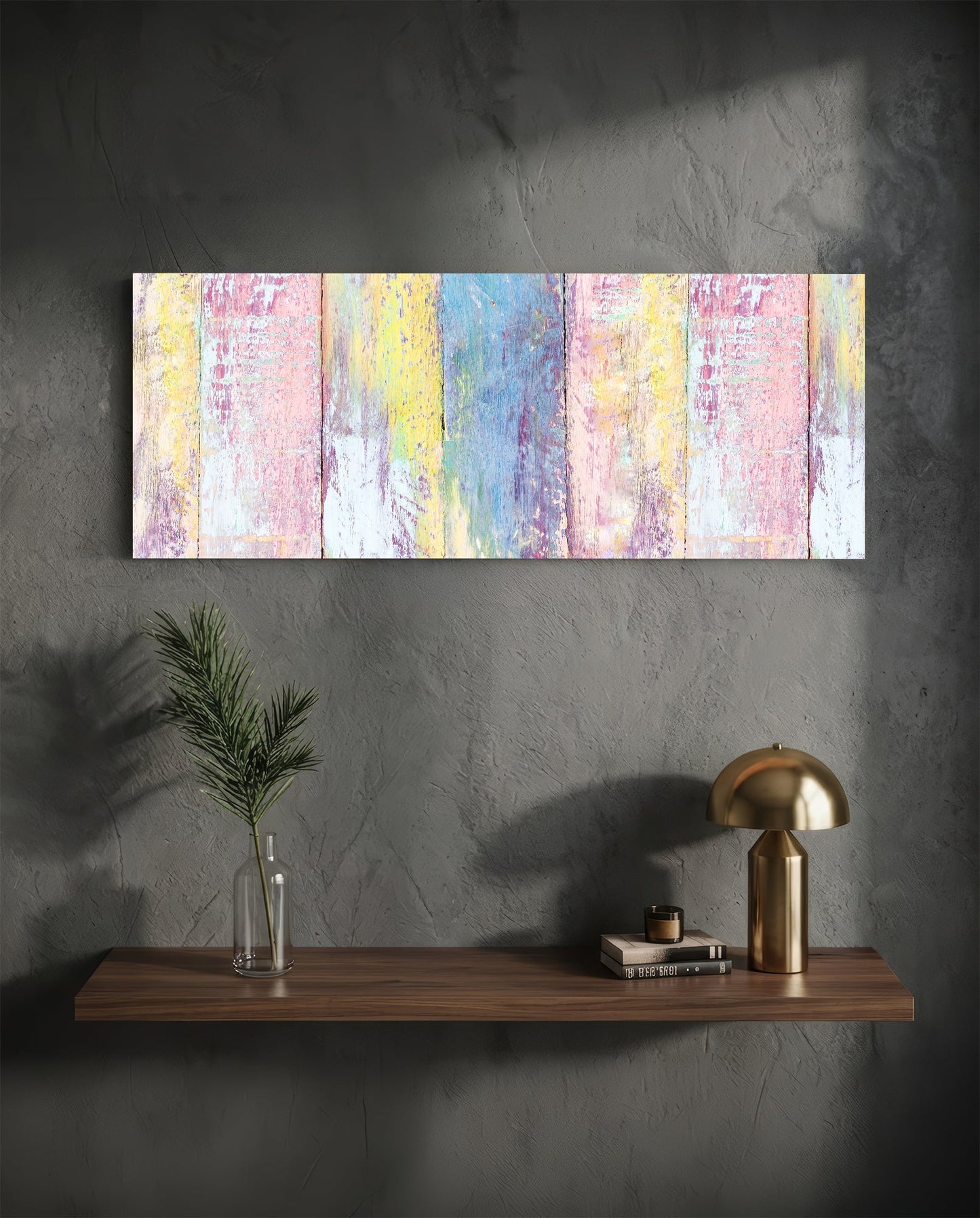 Horizontal painted wood glass wall art above wooden shelf displaying pastel pink, yellow, and blue distressed vertical stripes.